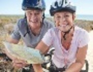 9449-Couple_Mountain_Biking_Smiling