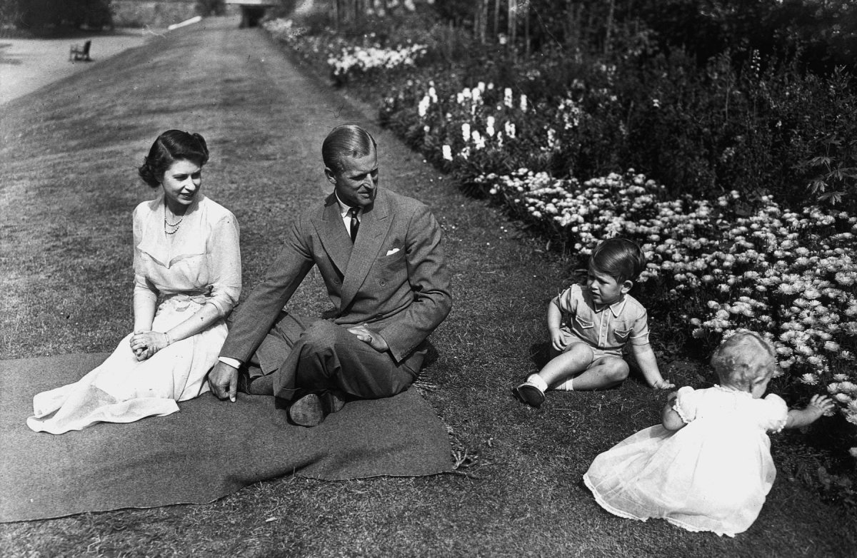 1951-the-familys-first-home-was-clarence-house-located-just-a-stones-throw-away-from-buckingham-palace-in-central-london-the-family-can-be-seen-playing-in-its-gardens-in-this-photo