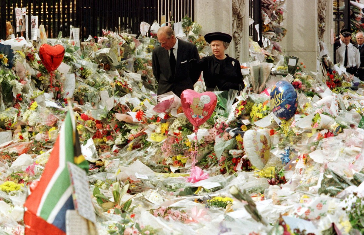 1997-philip-and-his-wife-queen-elizabeth-ii-walk-through-a-sea-of-flowers-left-by-the-public-outside-buckingham-palace-in-memory-of-princess-diana-who-was-killed-in-a-car-crash-in-paris-in-august-that
