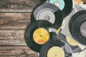 close up image of old records over wooden background , image is