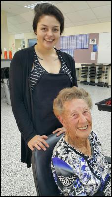 Hairdressing student Chantal Taylor with her 101-year- old client Valda Colwill.