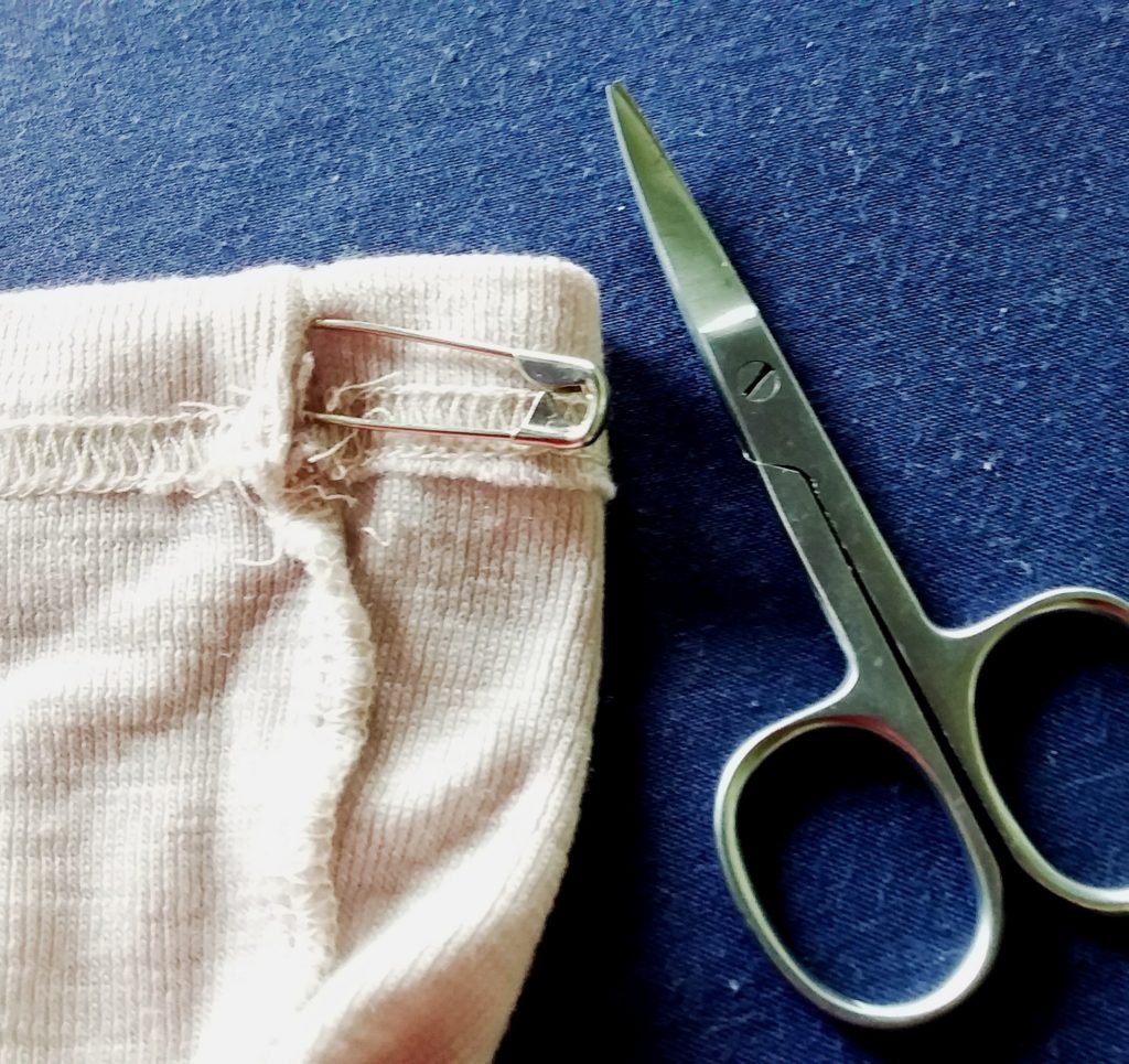 8. Create 2 holes in the factory edged hem one on each side of the bag. 8. Create 2 holes in the factory edged hem one on each side of the bag.