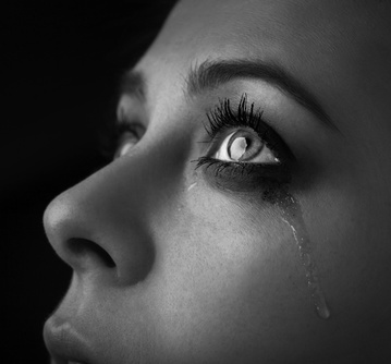 beauty girl cry on black background