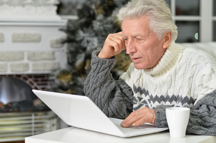 Senior man with laptop