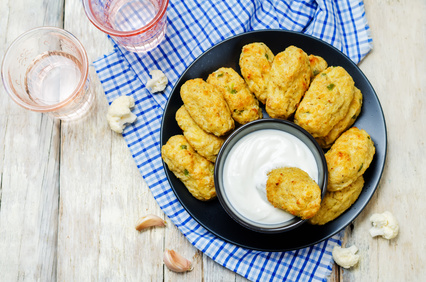 Baked cauliflower Tots on a wood background. toning. selective focus