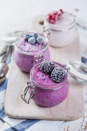 Selection of colourful overnight oatmeals with berries