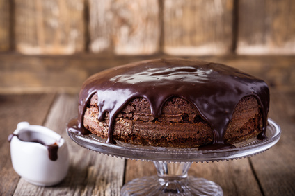 Homemade chocolate cake on glass cakestand