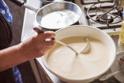 Grandmother making pancakes
