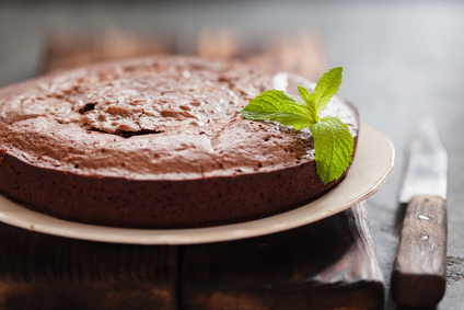 Chocolate cake brownie on gray background, closeup