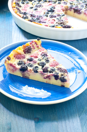 Clafoutis with cherries , blueberries and berries