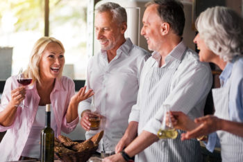 People having cooking party in kitchen of a house