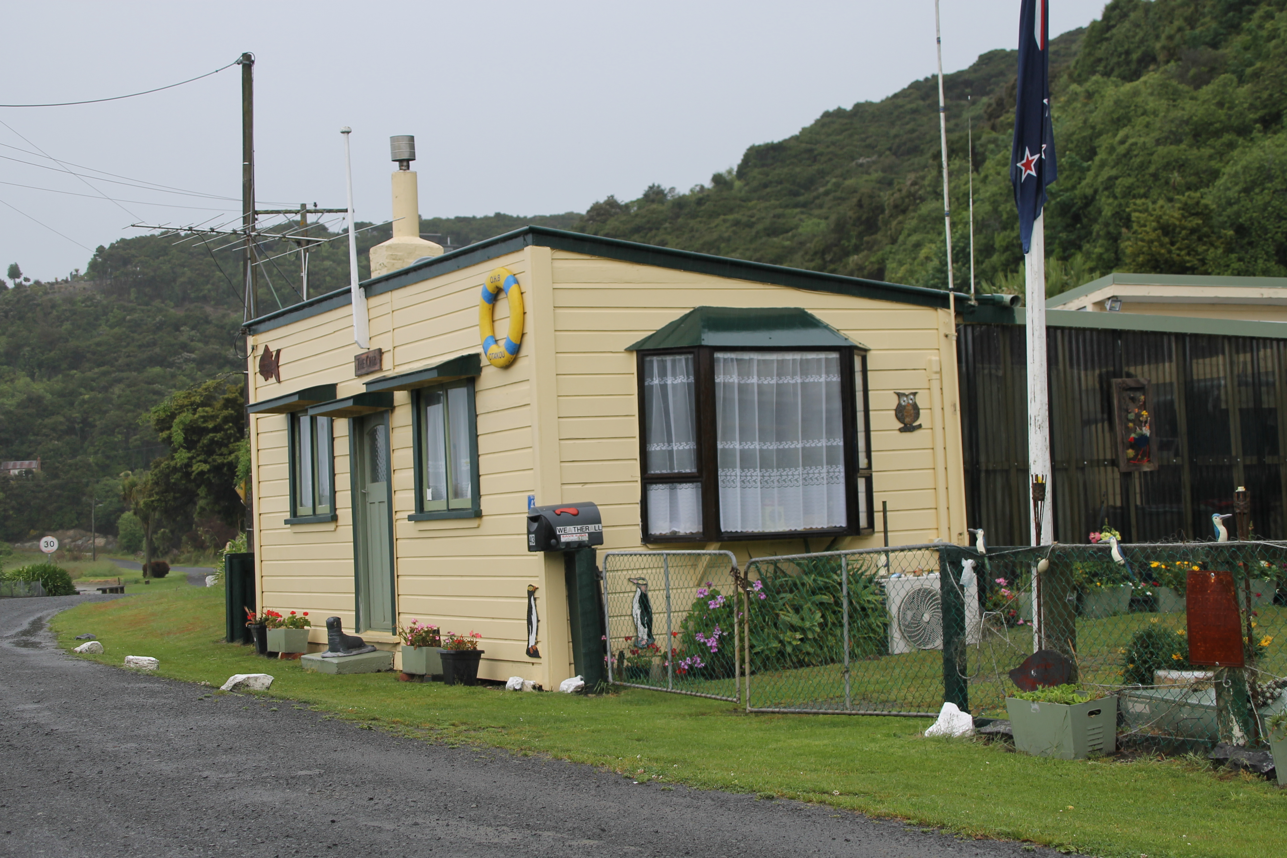 Quaint cottage at the entrance to the Taieri Gorge Track.