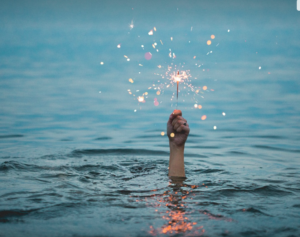 sparkler, water, hand