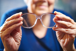 Old woman with eyeglasses. Senior people health care.