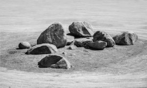 black and white photo of group of heavy stone for zen garden underconstruction under sunlight in daytime