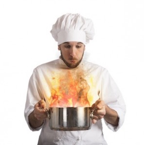 Chef blowing his burnt food in pot