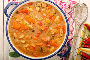 Chicken stew with hot chilli in metal pot
