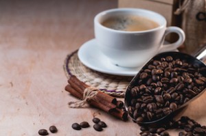 cup of coffee and coffee and scoop on the table