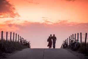 couple walking sunset 