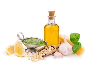 pesto sauce and its ingredients isolated on white background