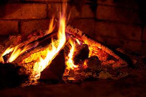 Burning flame fire in fireplace. Warm and comfortable.
