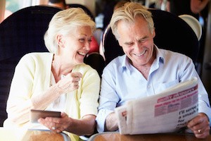 Senior Couple Relaxing On Train Journey