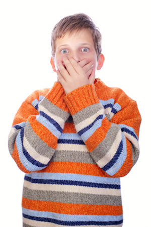 Worried child over his mouth from fear