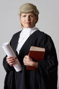 Portrait Of Female Lawyer Holding Brief And Book