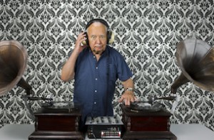 a very funky elderly grandpa dj mixing records