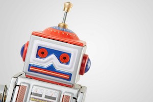 Robot vintage toy close up isolated on white, clipping path included