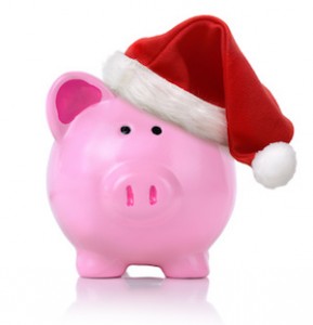 Piggy bank wearing a sant hat isolated