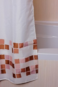 curtain in the bathroom near the tiled bath