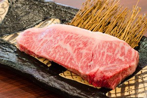 Close up Freshness Marbled on Japanese Kobe Matsusaka Beef for BBQ On The Plate in Restaurant  , King of Beef