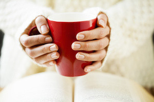 Woman holding a hot drink