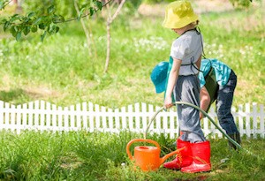 children gardening and watering