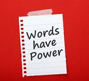 The phrase Words Have Power on a note taped to notice board